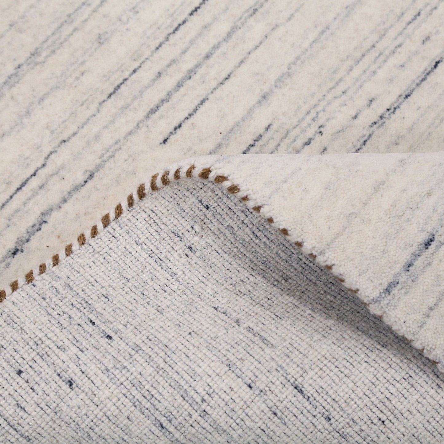 Contemporary Ivory Design Hand Loomed Wool Rug.