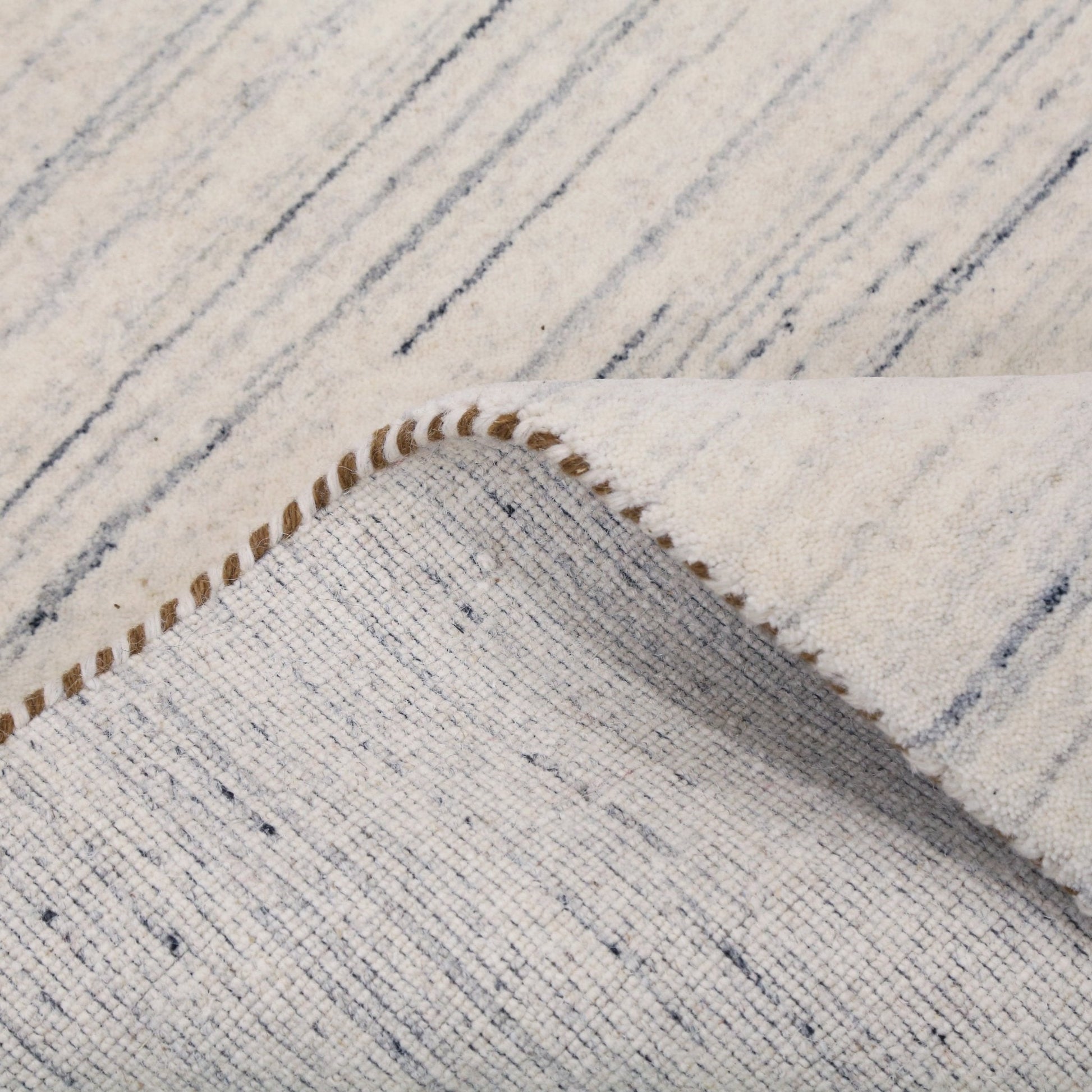 Contemporary Ivory Design Hand Loomed Wool Rug.
