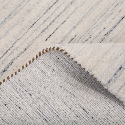 Contemporary Ivory Design Hand Loomed Wool Rug.