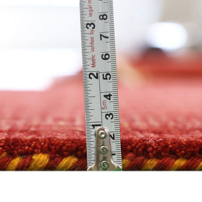 Red Center Pattern Hand Loomed Wool Area Rug.