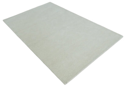 Custom Made Modern Solid Ivory Hand Tufted Wool Rug.