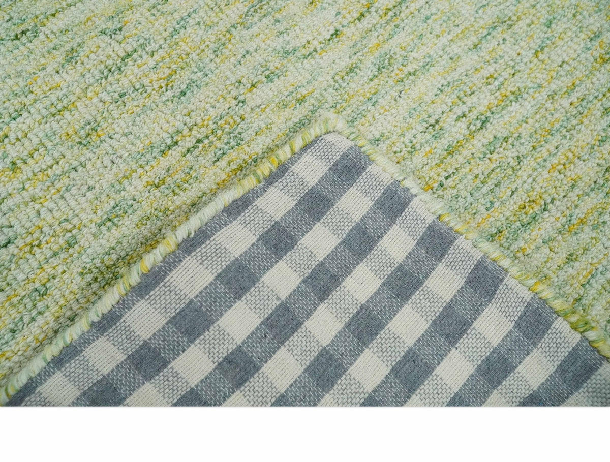 Custom Made Solid Green And Ivory Hand Tufted Natural Wool Area Rug.