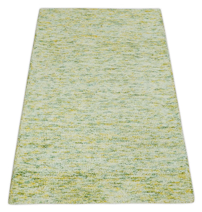 Custom Made Solid Green And Ivory Hand Tufted Natural Wool Area Rug.