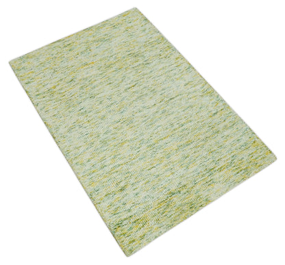 Custom Made Solid Green And Ivory Hand Tufted Natural Wool Area Rug.