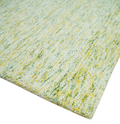 Custom Made Solid Green And Ivory Hand Tufted Natural Wool Area Rug.