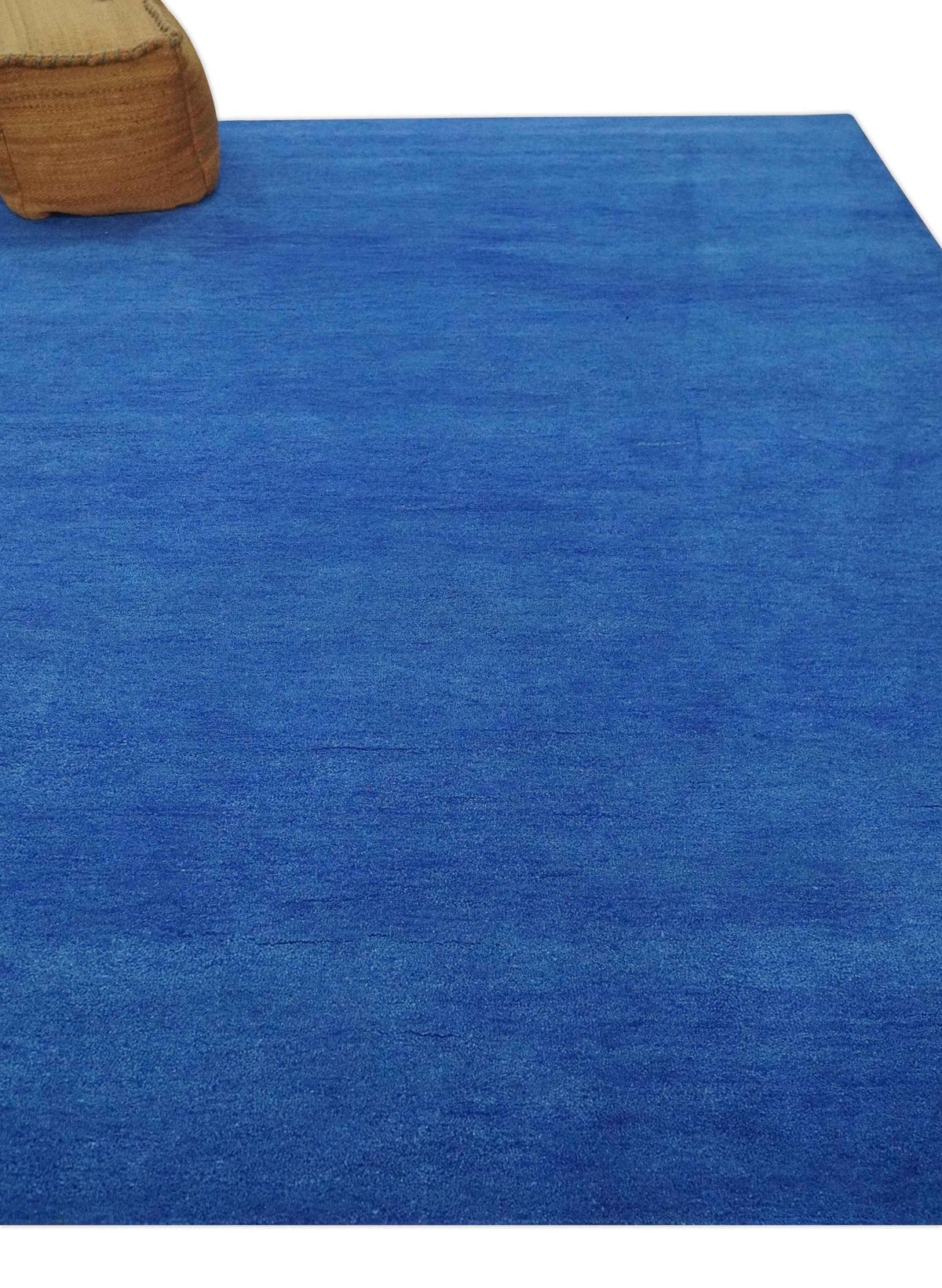 Custom made solid Blue Woolen Hand Tufted contemporary area Rug.