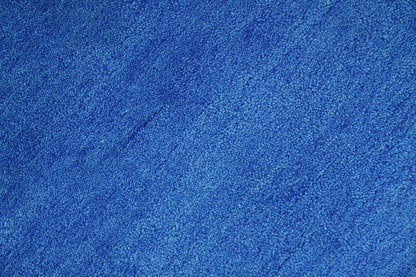 Custom made solid Blue Woolen Hand Tufted contemporary area Rug.