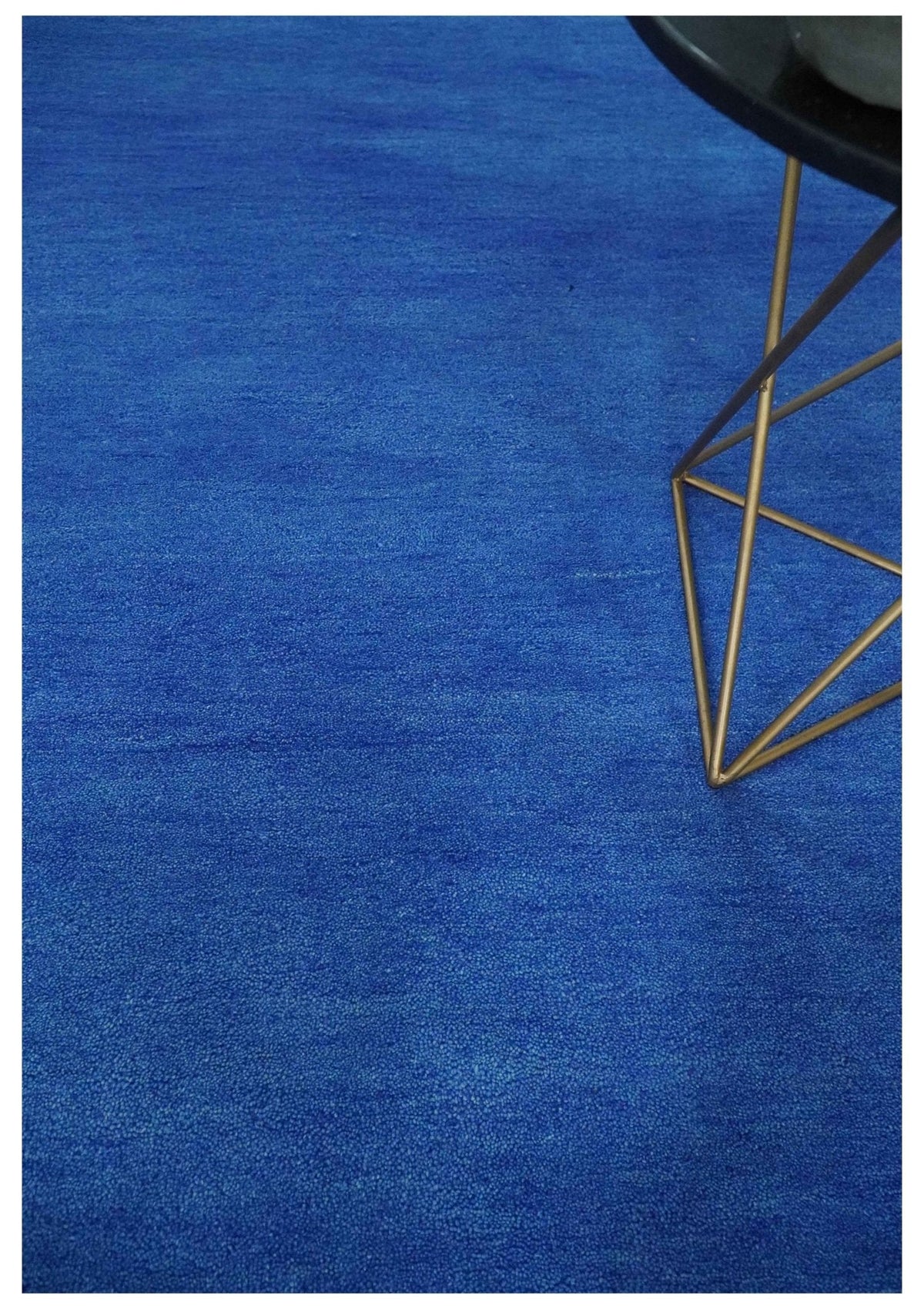 Custom made solid Blue Woolen Hand Tufted contemporary area Rug.