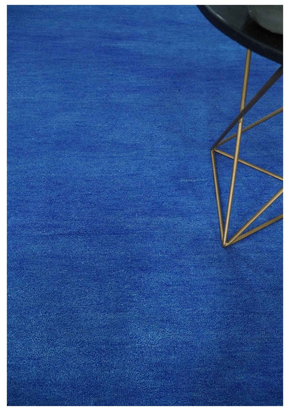 Custom made solid Blue Woolen Hand Tufted contemporary area Rug.