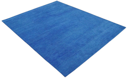 Custom made solid Blue Woolen Hand Tufted contemporary area Rug.