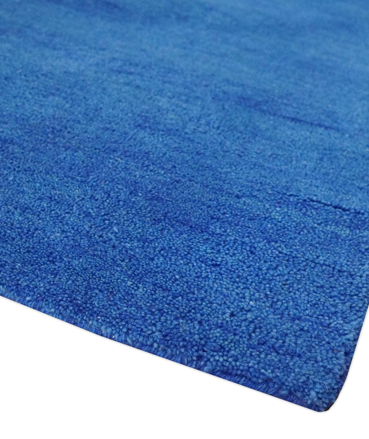 Custom made solid Blue Woolen Hand Tufted contemporary area Rug.