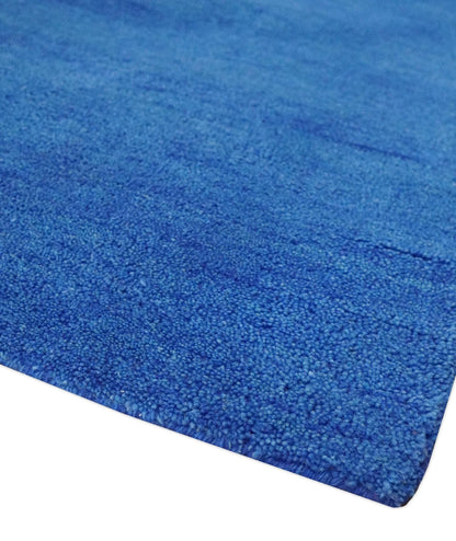 Custom made solid Blue Woolen Hand Tufted contemporary area Rug.