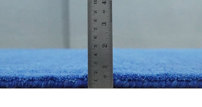 Custom made solid Blue Woolen Hand Tufted contemporary area Rug.