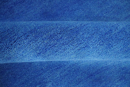 Custom made solid Blue Woolen Hand Tufted contemporary area Rug.