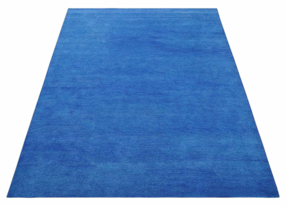 Custom made solid Blue Woolen Hand Tufted contemporary area Rug.