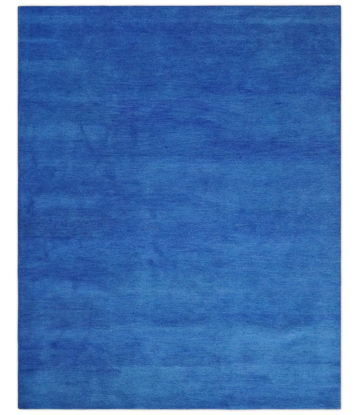 Custom made solid Blue Woolen Hand Tufted contemporary area Rug.