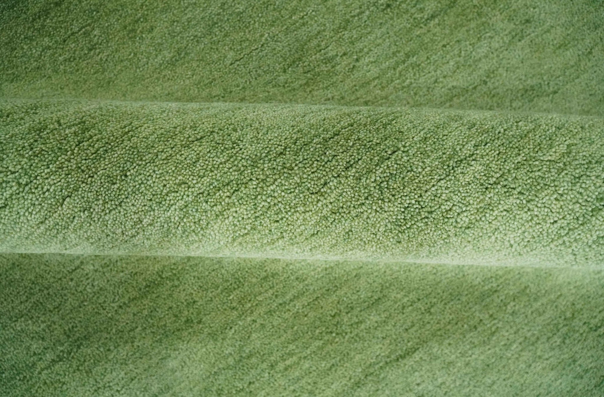Custom Made solid Green Woolen Hand Tufted contemporary area Rug.