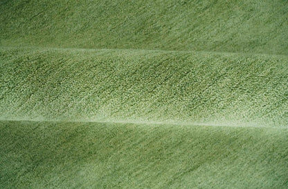 Custom Made solid Green Woolen Hand Tufted contemporary area Rug.