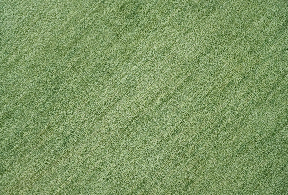 Custom Made solid Green Woolen Hand Tufted contemporary area Rug.