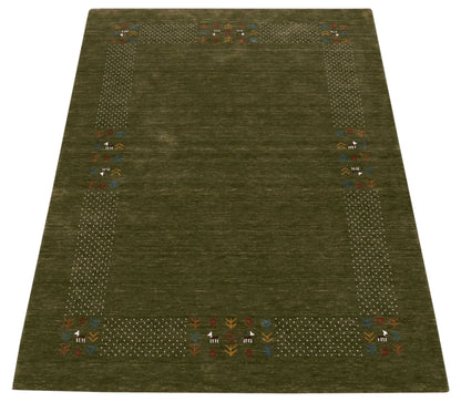 Solid with Border Patterns Hand Loomed Wool Area Rug.