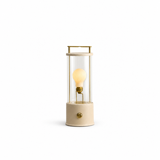 The Muse 1.0 Portable Lamp in Setting Plaster Pink on a white background