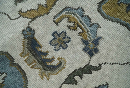 Traditional Ivory and Beige Hand Knotted Oriental Oushak Wool Area Rug.