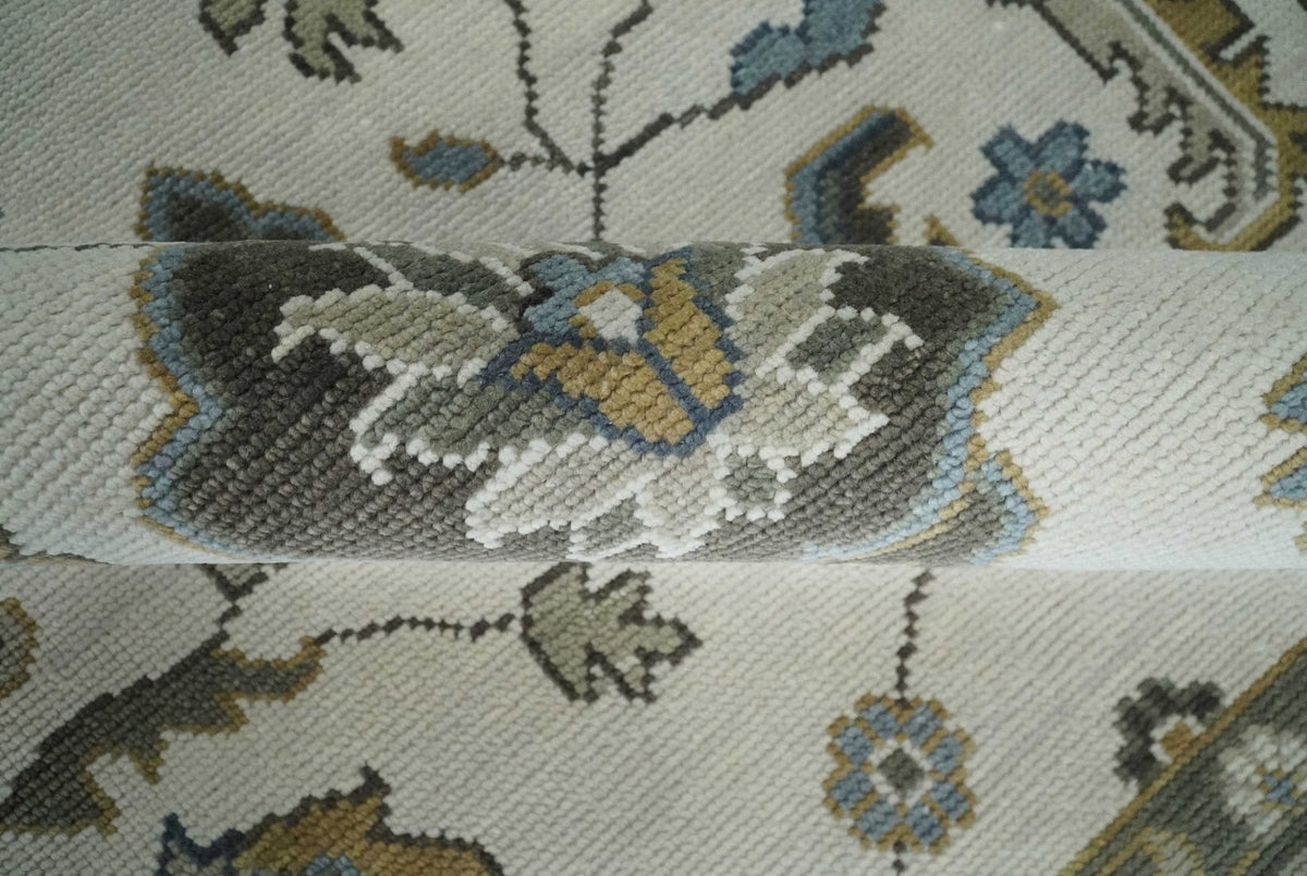 Traditional Ivory and Beige Hand Knotted Oriental Oushak Wool Area Rug.