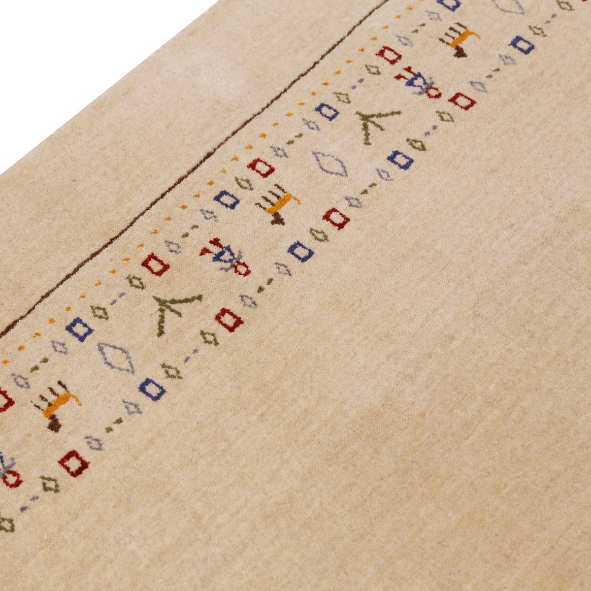 Tribal Border Ivory Design Hand Loomed Wool Area Rug.